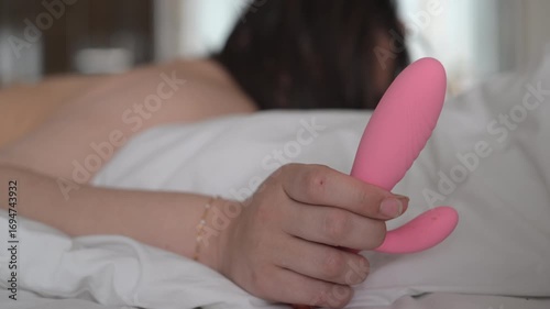 Woman seen holding a vibrator in her hand 