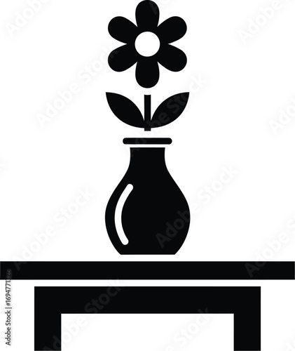 Simple black and white illustration of a flower in a vase on a table