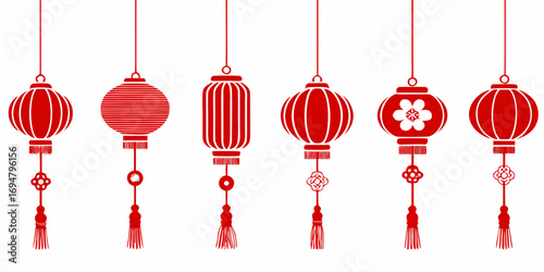 Collection of red chinese lanterns with tassels and ornaments hanging on white background