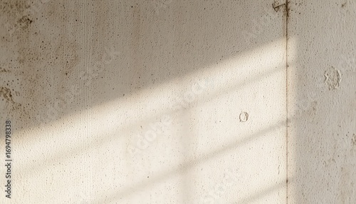 Abstract texture of off white wall in sunlight showing gentle shadows and surface details for design and creative projects