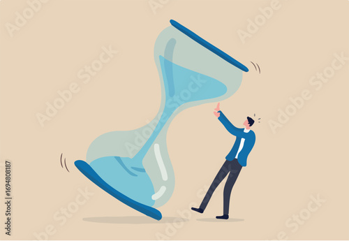 Project deadline, running out of time or time management concept, frustrated nervous businessman trying to stop hourglass or sandglass before it fall.