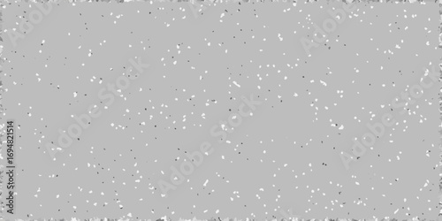Abstract grey background with scattered white and dark speckles and a textured border
