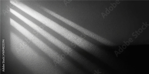 Abstract metallic grunge wall texture with a spotlight in black and white