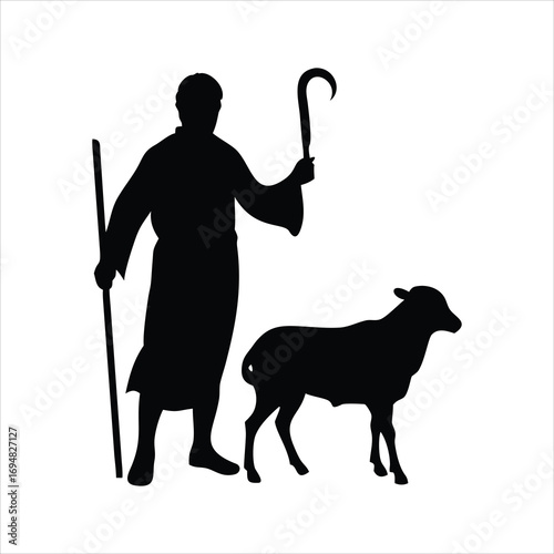 Silhouette of a shepherd holding a crook and staff with a sheep