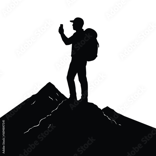Silhouette of a Traveler Taking a Photo with Smartphone at Mountain Peak
