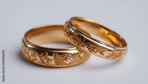 Gold wedding rings with floral engravings