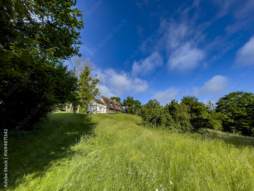 Obraz premium House and garden in Le Mesnil en Ouche, Eure, France
