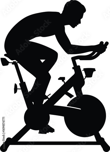 Silhouette of person cycling indoors stationary bike