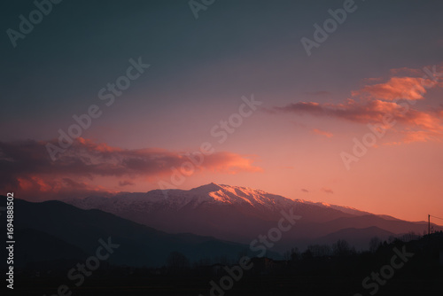 stunning sunset over majestic alps ultrabright sky painted with hues of orange pink and purple