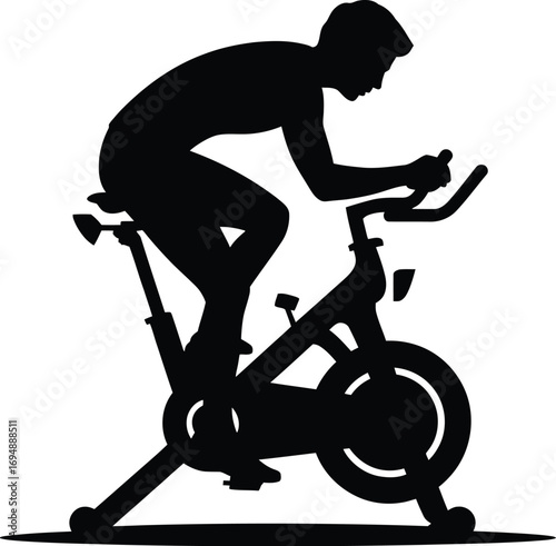Silhouette of person cycling indoors stationary bike