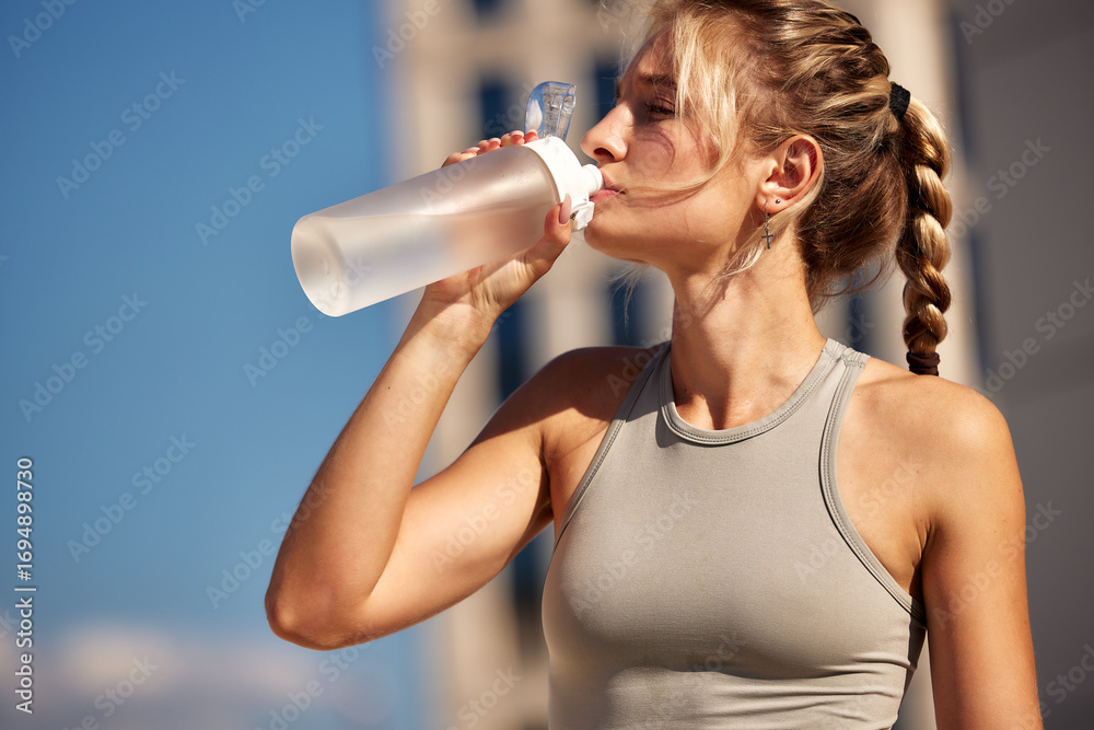 custom made wallpaper toronto digitalYoung woman drinking water outdoors during exercise on a sunny day