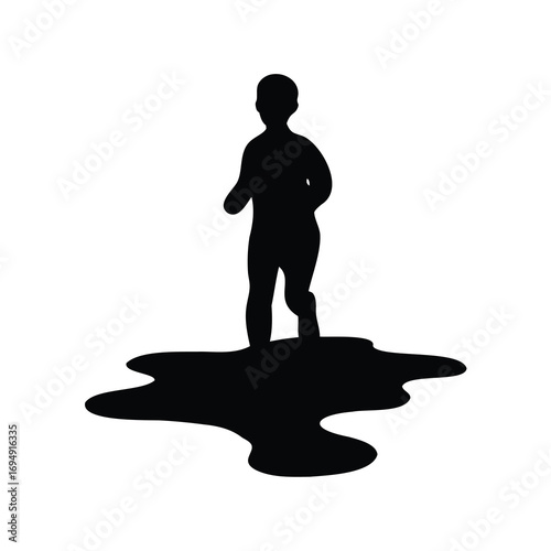 Silhouette of a child walking through a puddle, a moment of innocence