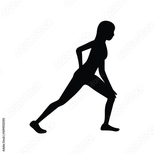 Silhouette of woman stretching her leg, in a dynamic yoga pose