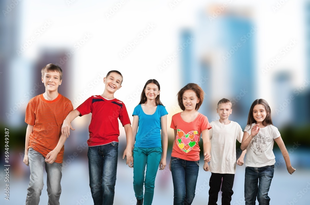 Obraz premium Multiethnic happy friends students hanging outside