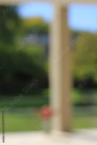 A dreamy view of a modern column on the portico.