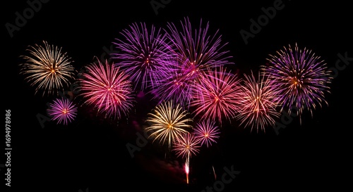 Fireworks display against black night sky colorful explosions celebration abstract background