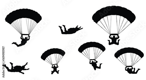 parachute jumpers in mid air action scene silhouette