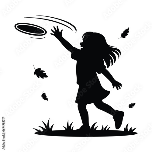 Silhouette of a girl playing with a frisbee outdoors in autumn