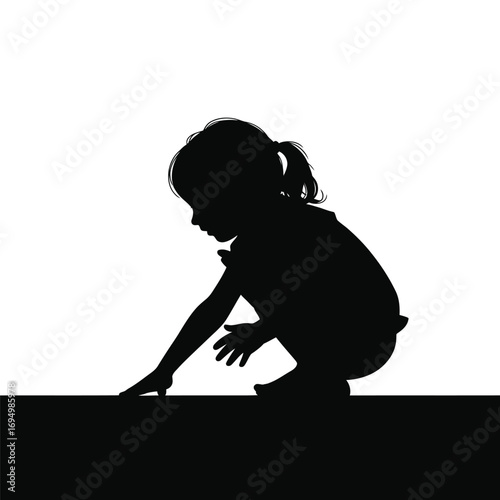 Silhouette of a Young Child Exploring with Hands on a Flat Surface