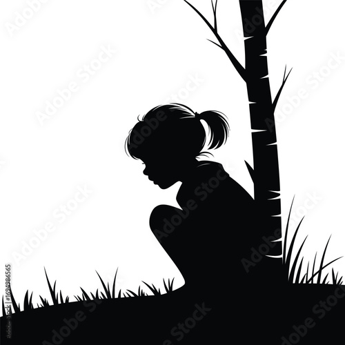 Silhouette of a Girl Squatting Near a Tree with Grass around