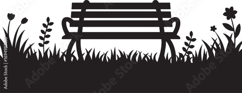 Silhouette of a vintage park bench with surrounding grass and flowers in black and white.