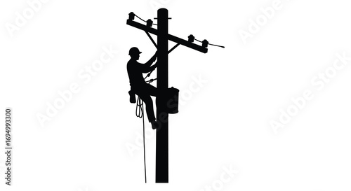 a worker climbs utility pole against sky silhouette
