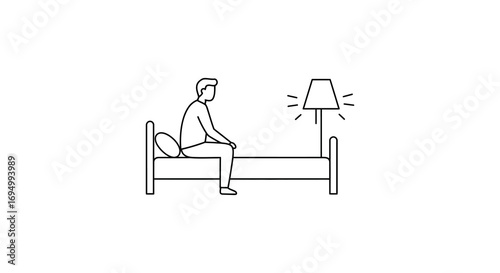 a person sitting on bed near glowing lamp silhouette