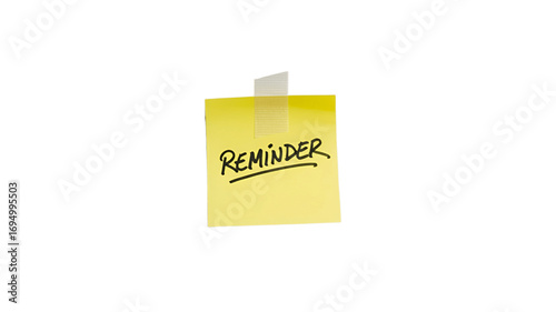 A yellow sticky note with the word Reminder on it.