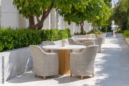 stylish modern outdoor caf featuring circular tables and square chairs with unique designs