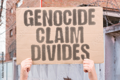 Fotografija “Genocide Claim Divides” Minister called a “prima facie genocide,” sparking fierce debate