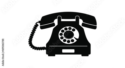 a classic black rotary telephone with coiled cord