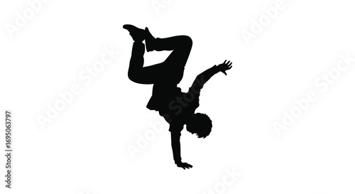a silhouette of a person performing an acrobatic handstand