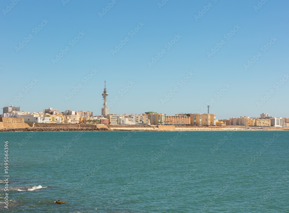Naklejka premium Cityscape view of Cadiz waterfront from the sea in Andalusia, Spain, September 2025.