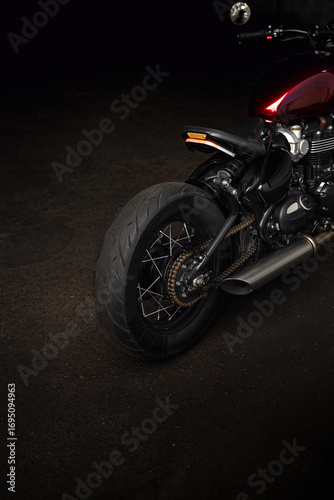 Red vintage motorcycle on the ground