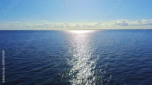 Experience a Serene and Beautiful Ocean View featuring Shimmering Sunlight Reflections