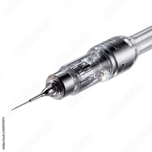 Close-up of a tattoo machine needle cartridge.  Transparent plastic and metallic components are visible.  Sharp needle tip angled slightly downward.  Internal mechanisms are partially exposed.