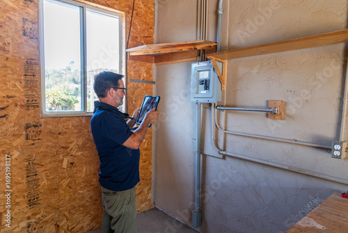 a home inspector checking an old electrical panel, inspection, 