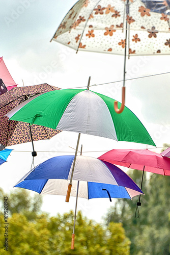 Colorful Umbrellas Hanging Against the Sky