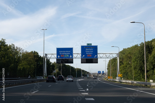 Road transportation in the Netherlands, Dutch highways, road signes, directions, driving car on multi line road, traffic jam in rush hours