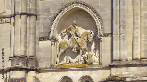 Sculpture of horseman on the wall of Eglise Sainte-Croix of Bordeaux, France on a summer day