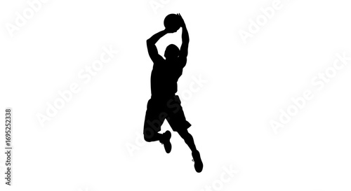 Silhouette of a basketball player jumping to dunk the ball with power and grace