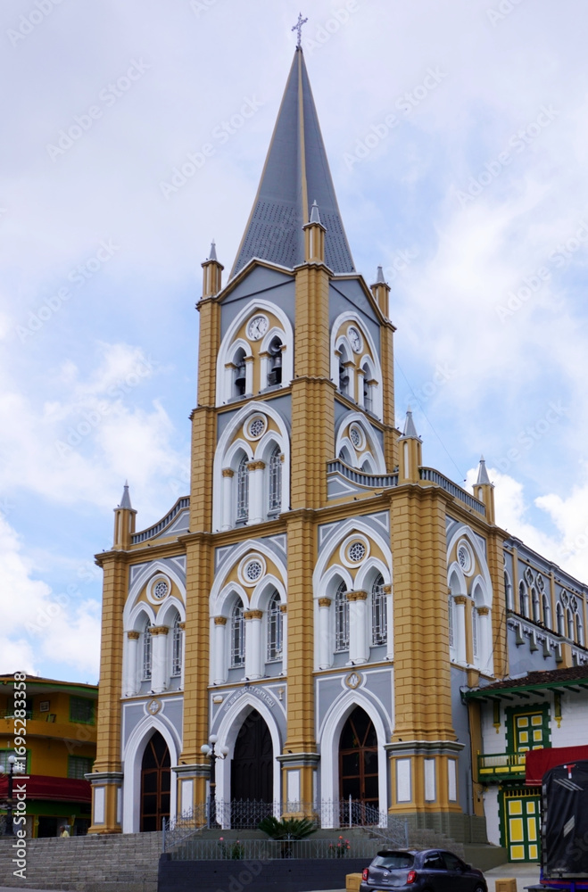 Fototapeta premium Caramanta, Antioquia, Colombia; March 28, 2024: One side view of the Immaculate Conception Church at the main square of Caramanta.