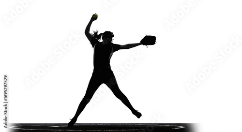 Dynamic silhouette of a softball pitcher in mid-motion showcasing athleticism and action