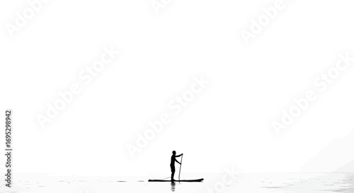 Solitary journey a figure paddleboarding on calm waters in minimalistic monochrome composition