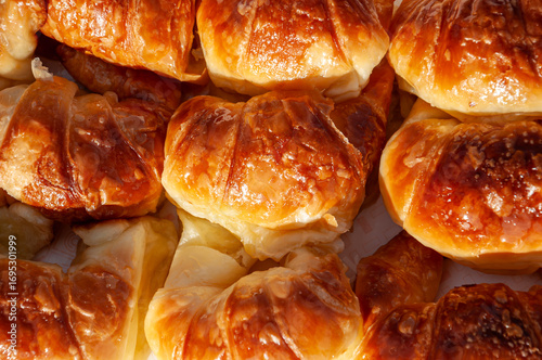 Delicious golden Argentine medialunas, buttery croissants with a soft texture and irresistible shine, perfect for breakfast or coffee time.