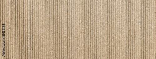 Textured close-up of natural brown paper with fine lines, suitable for backgrounds or crafts