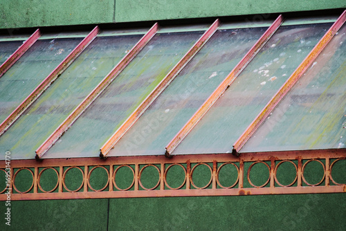 worn metal and glass awning