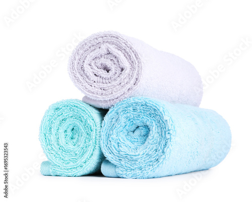 Stack of rolled terry towels isolated on white