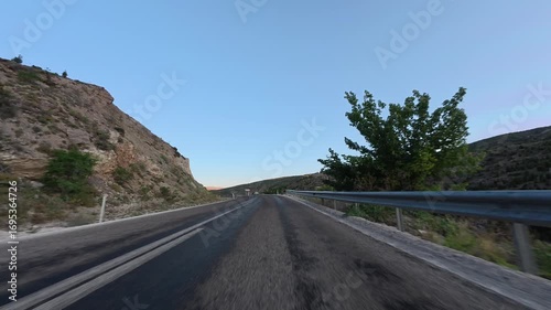 Mountain road curve. Road trees sky. High quality photo