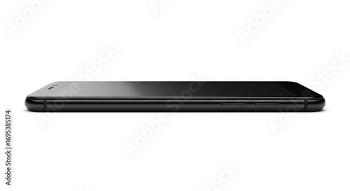 A sleek black smartphone lies flat on a white surface, showcasing its minimalist design and smooth lines, ideal for modern technology and mobile device illustrations .
